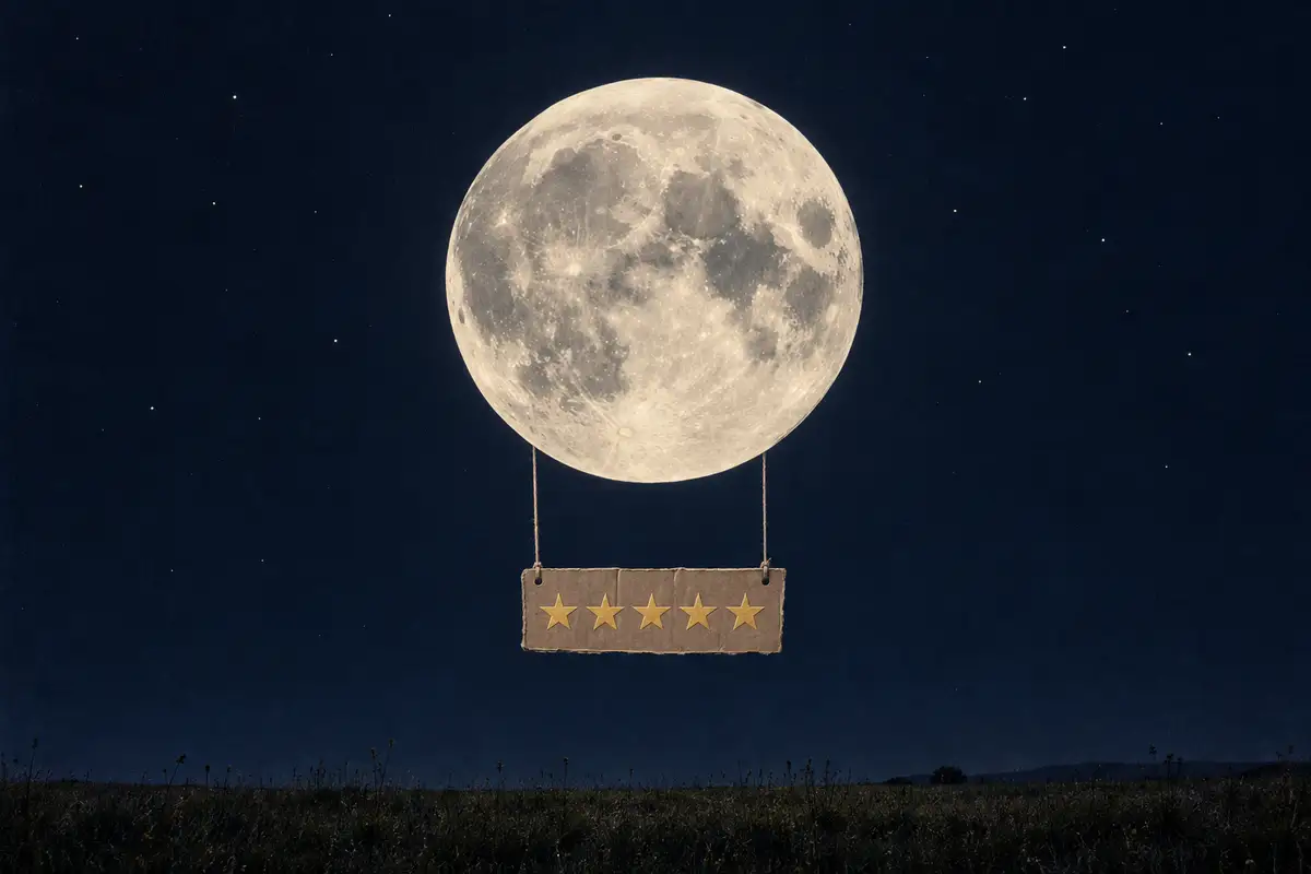 The full moon hangs above a field with a cardboard five-star rating suspended beneath it.